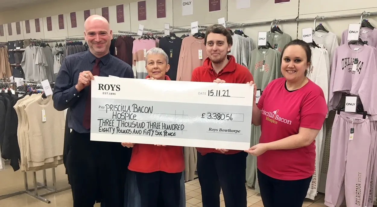 Roys Bowthorpe Store Manager Lee Hodds & staff members Lindsey & Paul Carr present a cheque for £3380 to Claire Feek of Priscilla Bacon Hospice