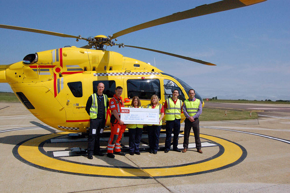 Roys Staff presenting a cheque of £4000 to the East Anglian Air Ambulance