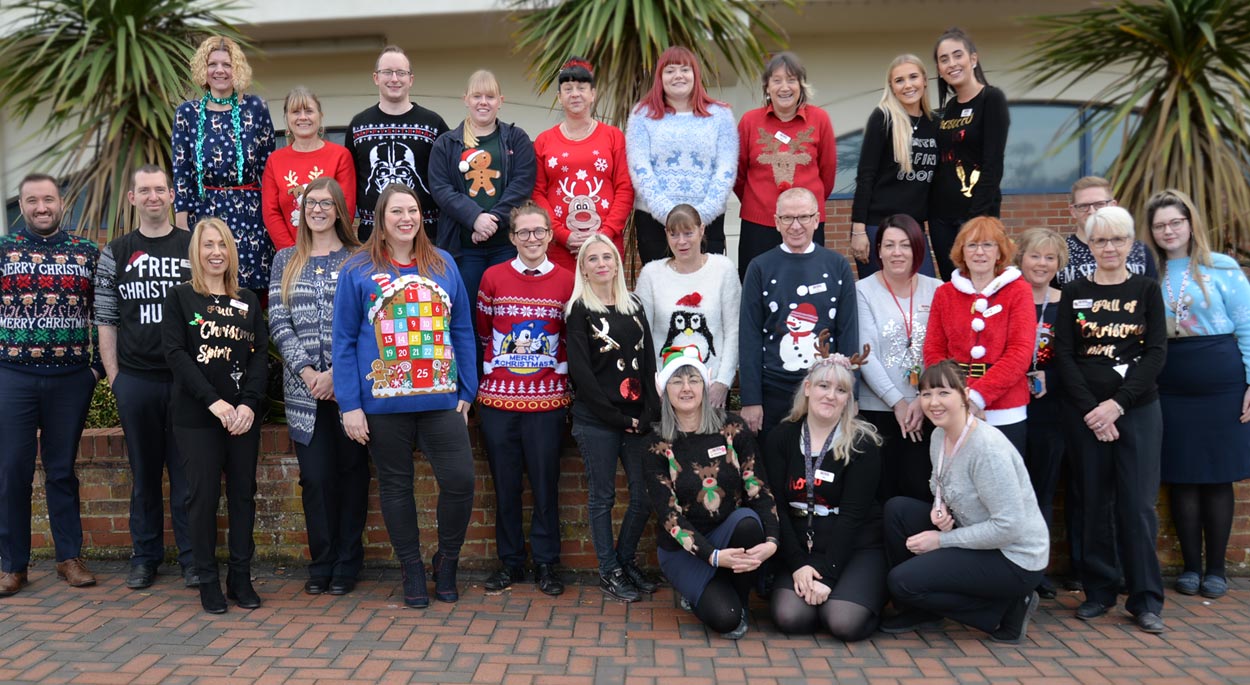Photo: Roys of Wroxham stores and office staff in their Christmas Jumpers